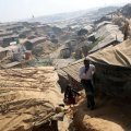 Rohingya refugees walk along the Kutupalong refugee camp in Cox’s Bazar, Bangladesh, on January 21.