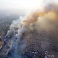 A wildfire moves closer to North Tustin homes along the 261 freeway in Tustin, Calif. on Oct. 9. 