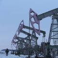 Russia May Speed Up Cuts in Oil Output