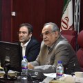 Economy Minister Masoud Karbasian (R), and director of Securities and Exchange Organization, Shapour Mohammadi.