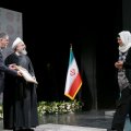 Silvia Balatti from University of Kiel, Germany,(R) receives her award from President Hassan Rouhani (C)  and Culture Minister Seyyed Abbas Salehi.