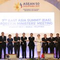 Foreign ministers from Southeast Asia and their dialogue partners link arms during the group photo at the start of the 7th East Asia Summit Foreign Ministers’ Meeting and its dialogue partners  as part of the 50th ASEAN regional security forum in Manila on August 7.