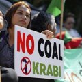 A woman protests a planned coal-fired plant  in southern Thailand.