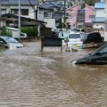 Floods and landslides swept the western part of Japan, leaving the government with $2.44 billion bill  to rebuild areas destroyed by the disasters.