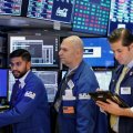 Dow futures dropped more than 100 points in early trading, as traders returned from the long holiday  weekend to face fresh selling pressure for US stocks.