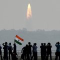 Onlookers watch the launch of satellites at Sriharikota, India, on Feb. 15.