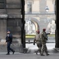 French police officers and soldiers patrol in front of the Louvre museum in Paris, France, on Feb. 3.