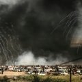 Israeli forces shoot tear gas at demonstrators  along the Gaza border on June 29.