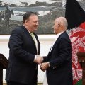 US Secretary of State Mike Pompeo (L) and Afghan President Ashraf Ghani shake hands after a press conference at the presidential palace in Kabul on July 9.