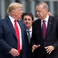 US President Donald Trump (L) and Turkish President Recep Tayyip Erdogan talk  at the start of the NATO summit in Brussels, Belgium, on July 11.