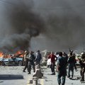 Afghan security forces arrive at the site of a car bomb attack in Kabul on May 31.